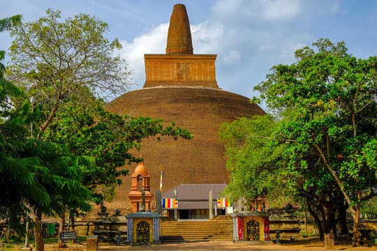 Massive Abhayagiriya Stupa with surrounding ruins, once a global center of Buddhist learning and meditation.